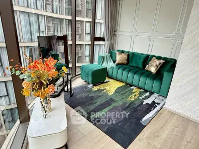 Luxurious living room with green velvet sofa and stunning city view.