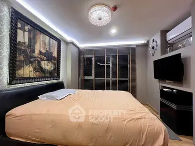 Luxurious bedroom with modern decor and ambient lighting, featuring a cozy bed and stylish wall art.