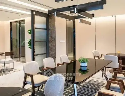 Elegant dining area with modern lighting and stylish furniture in a contemporary setting.