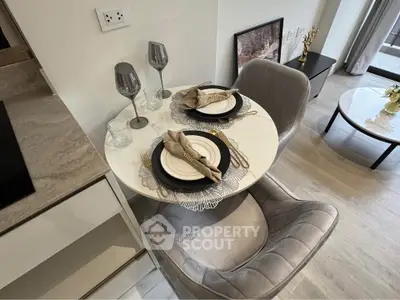 Modern dining area with elegant table setting in a stylish apartment