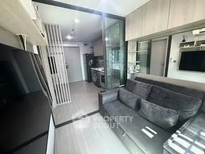 Modern living room with sleek design and open kitchen layout