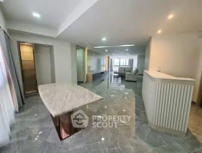 Spacious modern living room with marble flooring and elegant furnishings