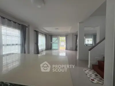 Spacious living room with large windows and modern design