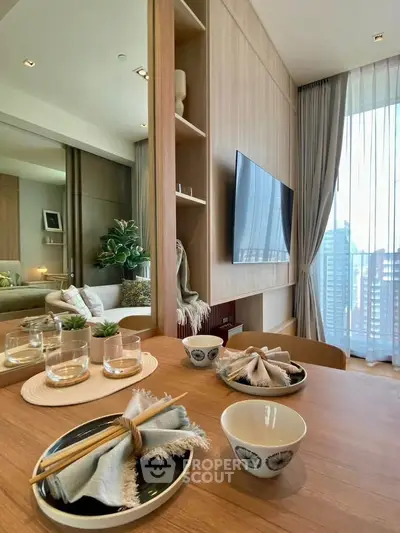 Modern living room with elegant decor and city view, featuring a stylish dining setup and large TV.