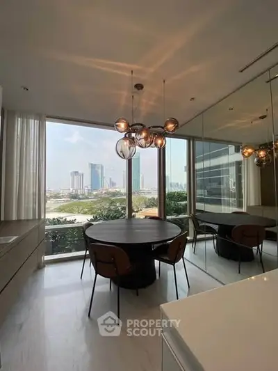 Modern dining area with stunning city view and stylish lighting in high-rise apartment.