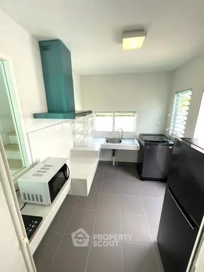 Modern kitchen with sleek appliances and open layout design