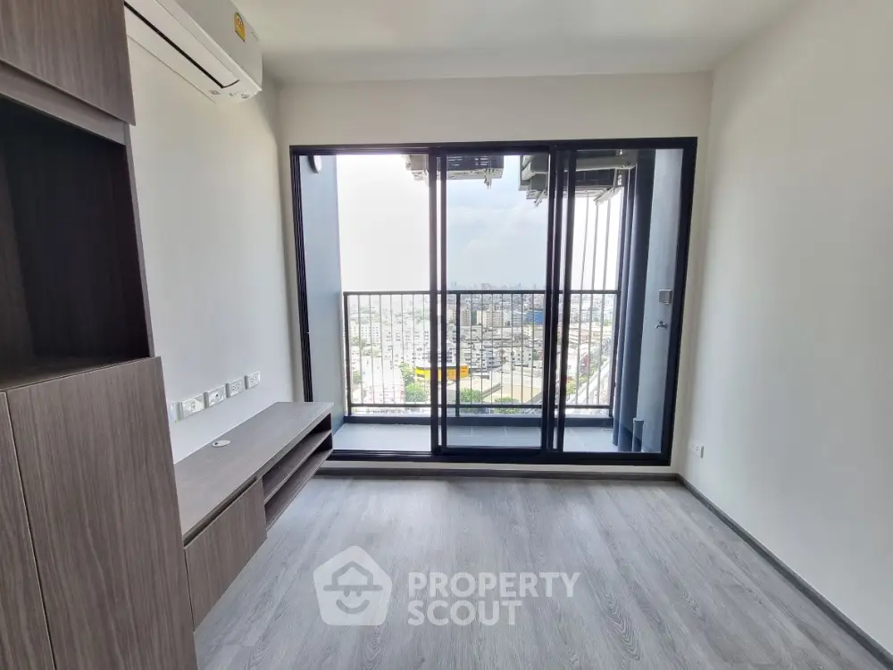 Modern apartment living room with large balcony and city view