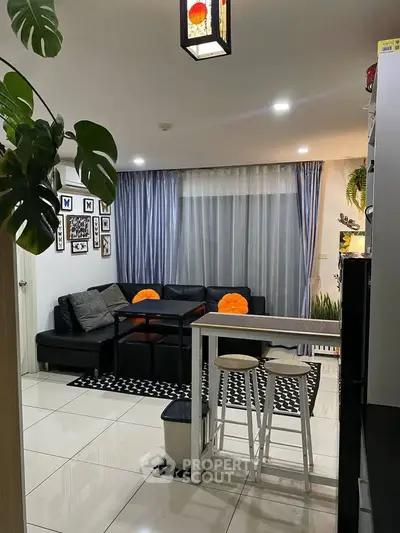 Modern living room with stylish decor and cozy seating area.