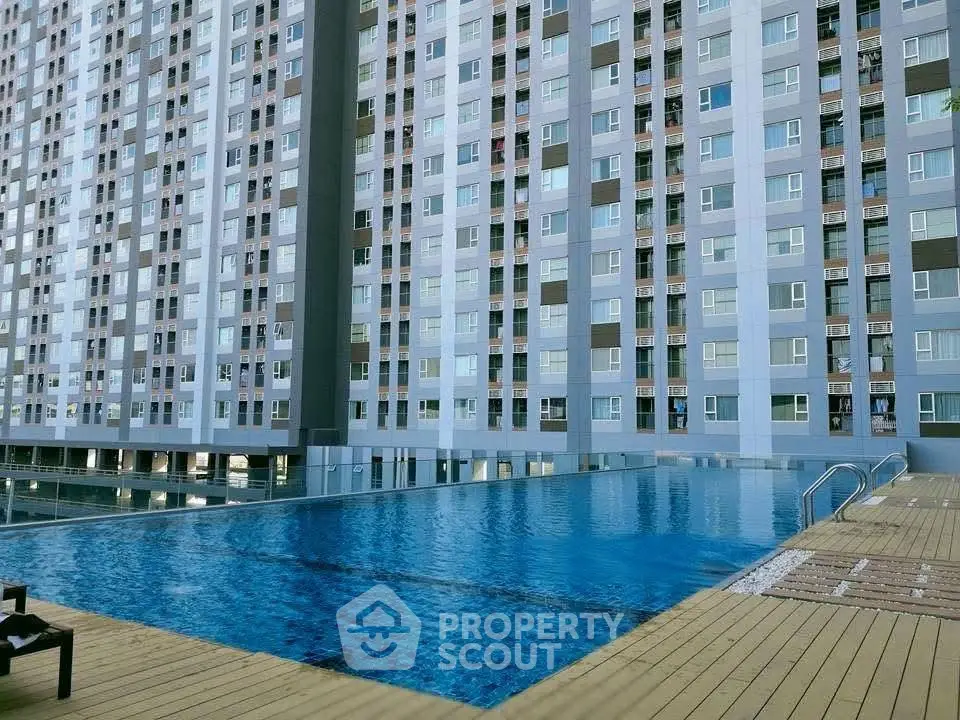 Luxurious high-rise apartment with stunning poolside view and modern architecture.