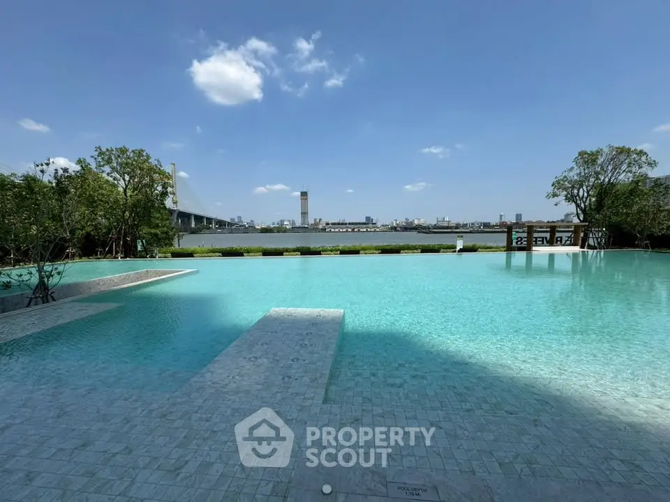 Luxurious infinity pool with stunning cityscape and river views, perfect for relaxation and leisure.