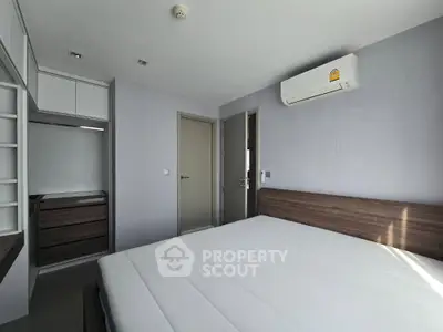 Modern bedroom with minimalist design and air conditioning