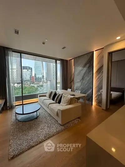 Luxurious living room with stunning city view, modern decor, and elegant furnishings in a high-rise apartment.