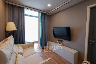 Cozy living room with modern decor and wall-mounted TV
