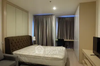Spacious bedroom with elegant furnishings and ample natural light, perfect for comfortable living.