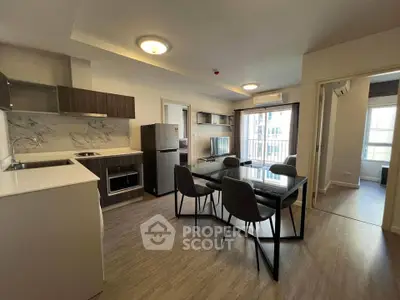 Modern open-plan kitchen and dining area with sleek design and natural light.