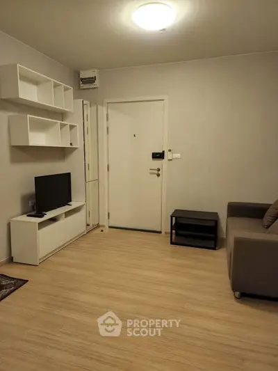 Modern living room with minimalist decor and wooden flooring