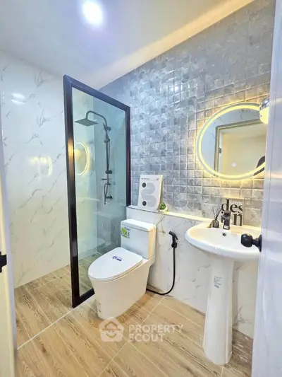 Modern bathroom with sleek shower and elegant tile design