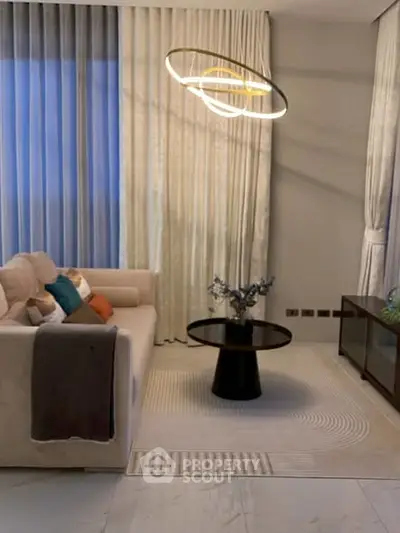 Elegant living room with modern lighting and cozy sofa