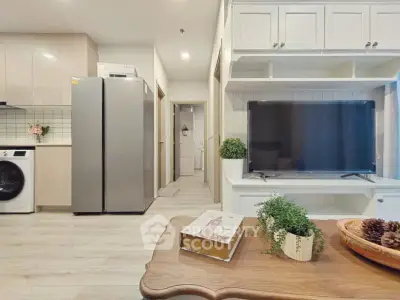 Modern living room with sleek kitchen appliances and stylish decor