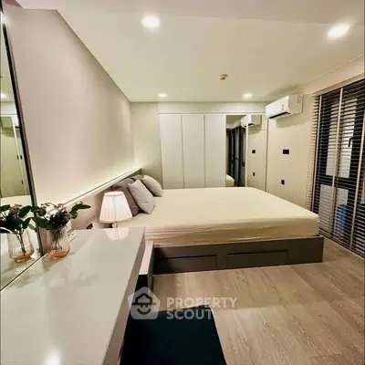 Modern bedroom with sleek design and ample natural light