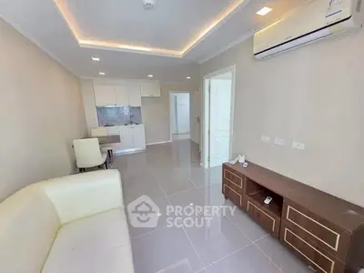 Modern living room with sleek design and open kitchen layout