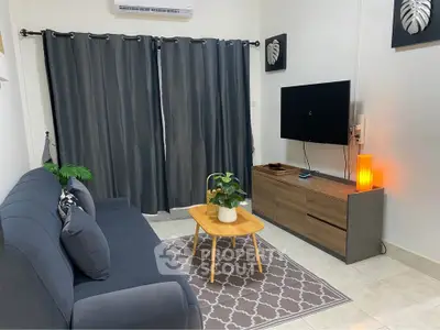 Cozy living room with modern decor and wall-mounted TV