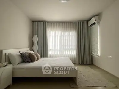 Modern minimalist bedroom with elegant curtains and air conditioning