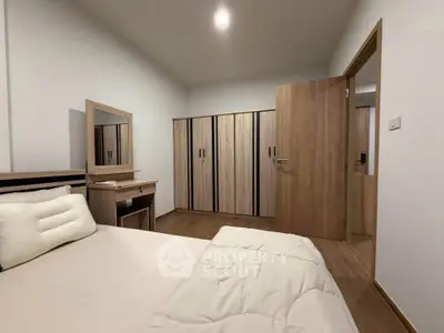 Modern bedroom with wooden furniture and ample closet space