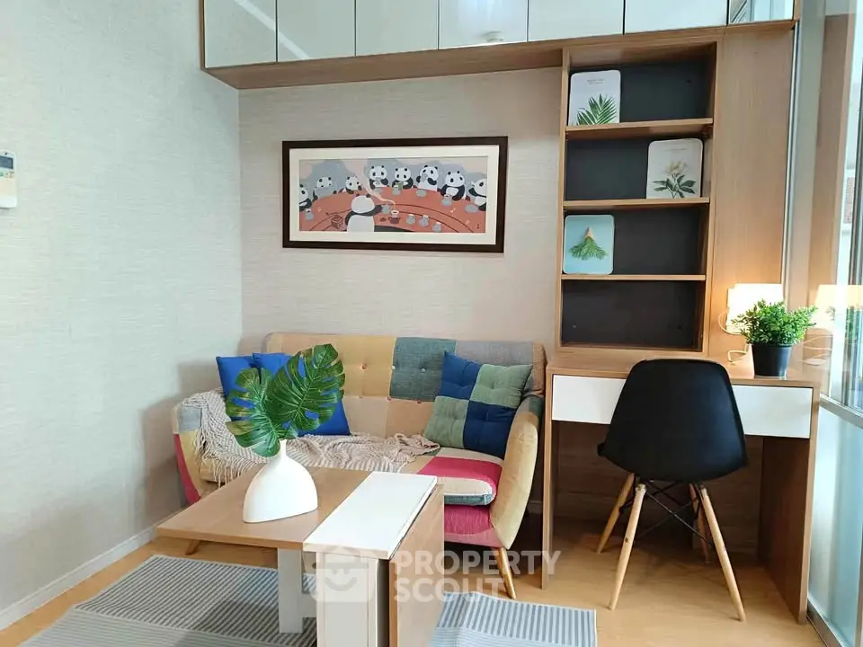 Charming living room with colorful sofa and modern decor, perfect for cozy relaxation.