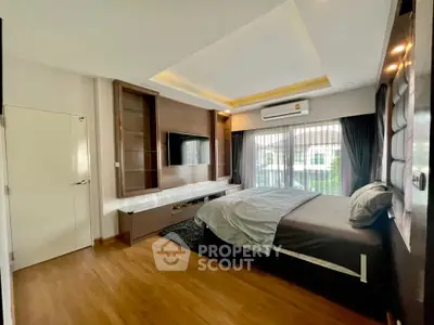 Spacious modern bedroom with large windows and stylish decor
