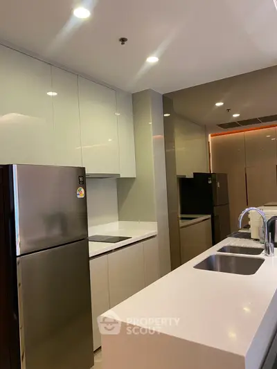 Modern kitchen with sleek cabinetry and stainless steel appliances