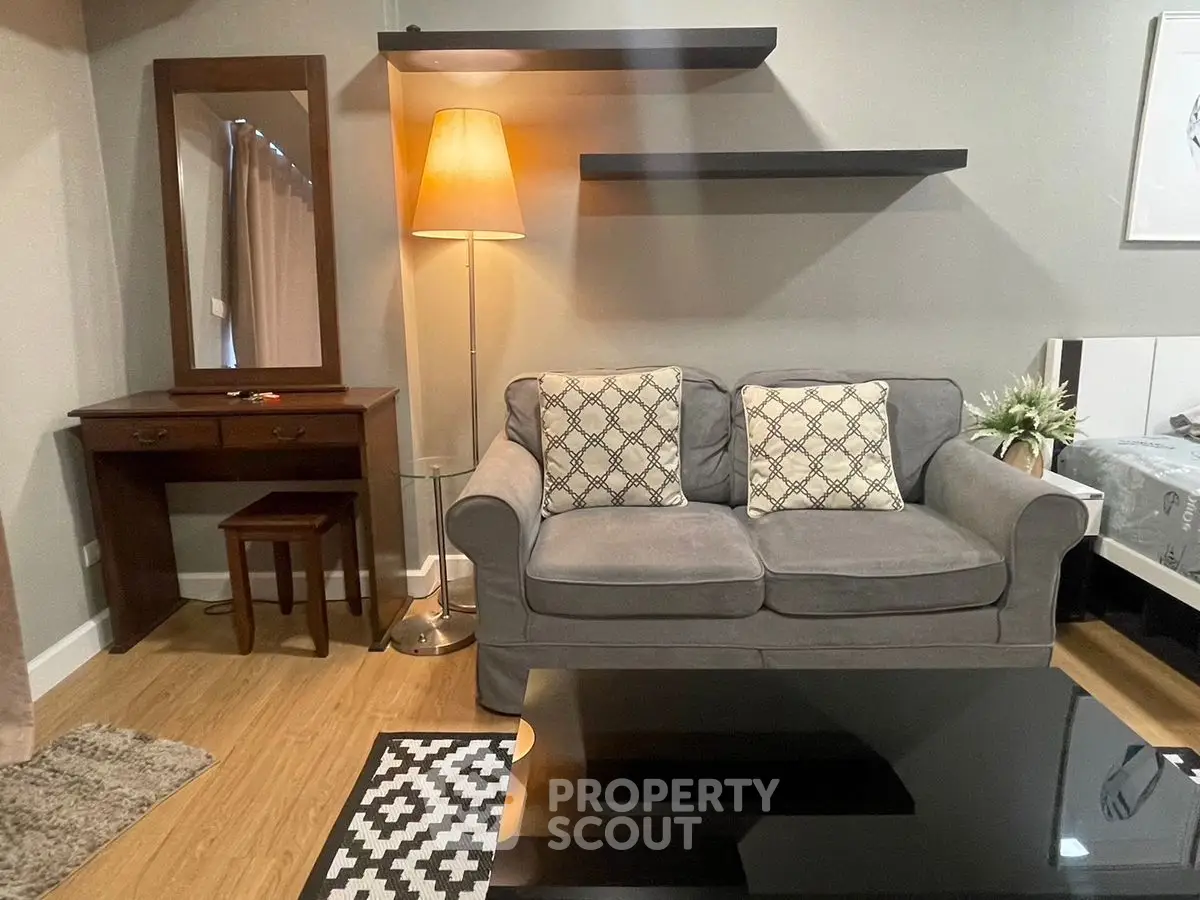 Cozy living room with stylish gray sofa and elegant decor