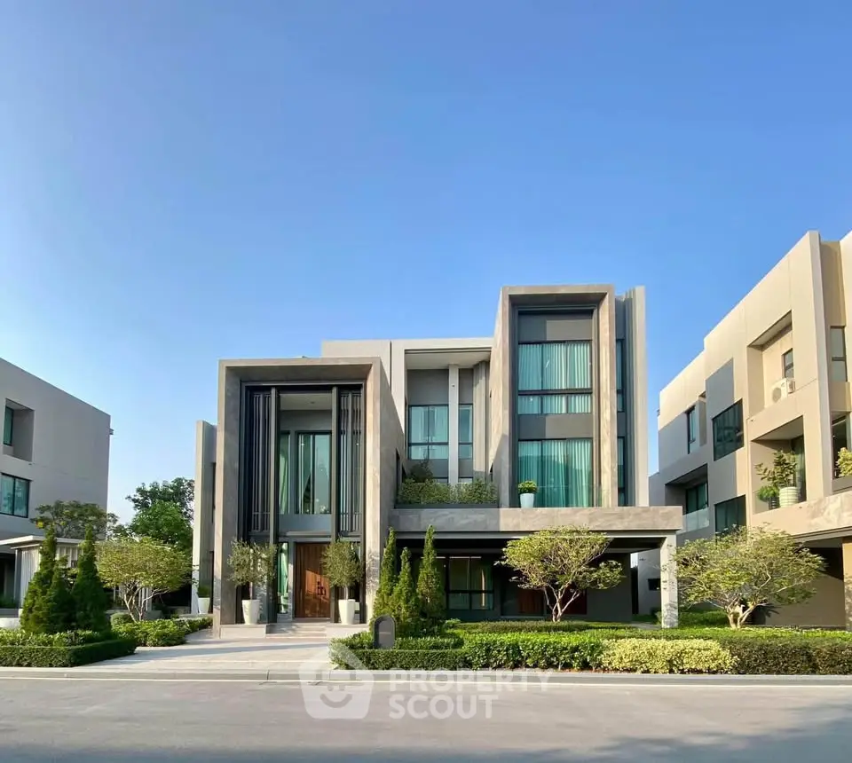 Modern luxury home with sleek architectural design and lush landscaping, perfect for upscale living.