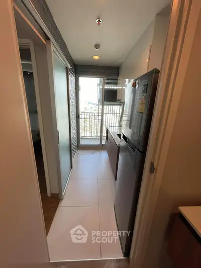 Modern kitchen with sleek design and balcony view