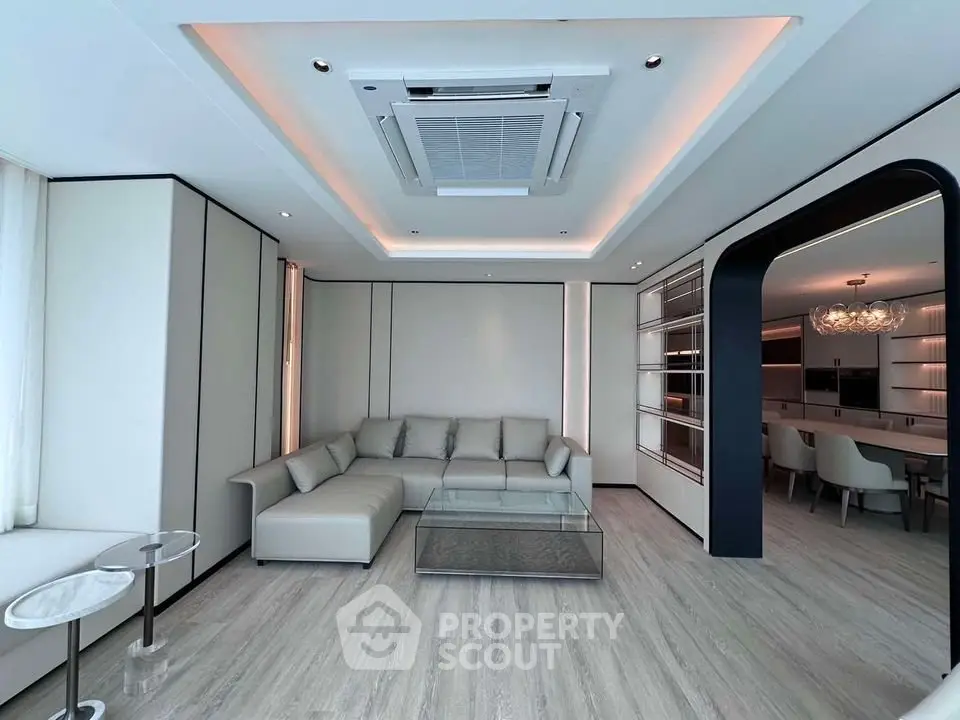 Luxurious modern living room with sleek design and spacious seating area.