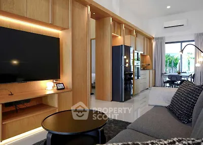 Modern living room with open kitchen, sleek design and natural light