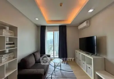 Modern living room with city view, featuring cozy sofa, stylish lighting, and large TV, perfect for urban living.