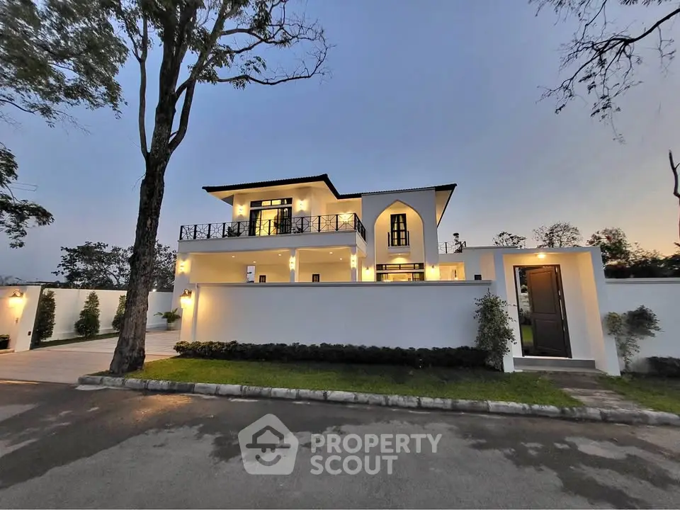 Stunning modern villa with elegant architecture and lush surroundings at dusk.