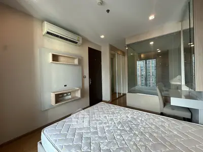 Modern bedroom with air conditioning and glass partition in a high-rise apartment