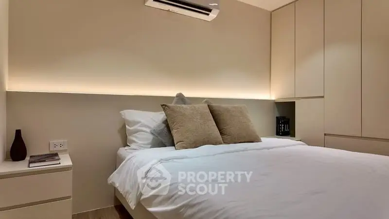 Modern bedroom with cozy lighting and minimalist design