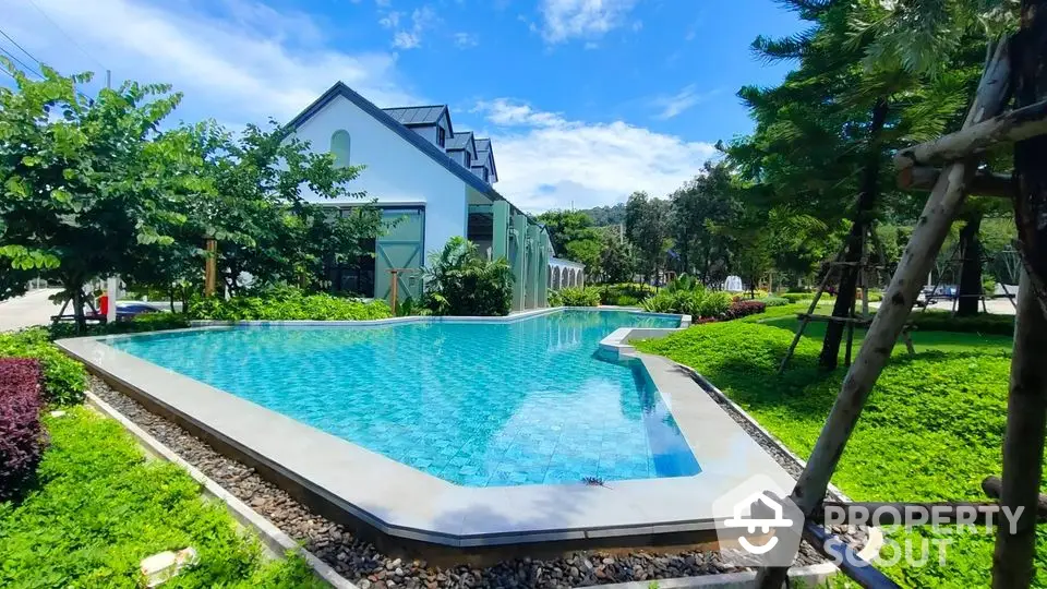 Stunning modern poolside view with lush greenery and contemporary architecture