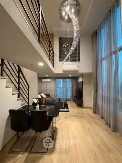 Luxurious modern duplex living room with high ceilings and elegant chandelier