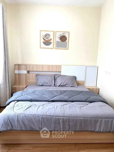 Cozy bedroom with modern wooden bed frame and stylish decor