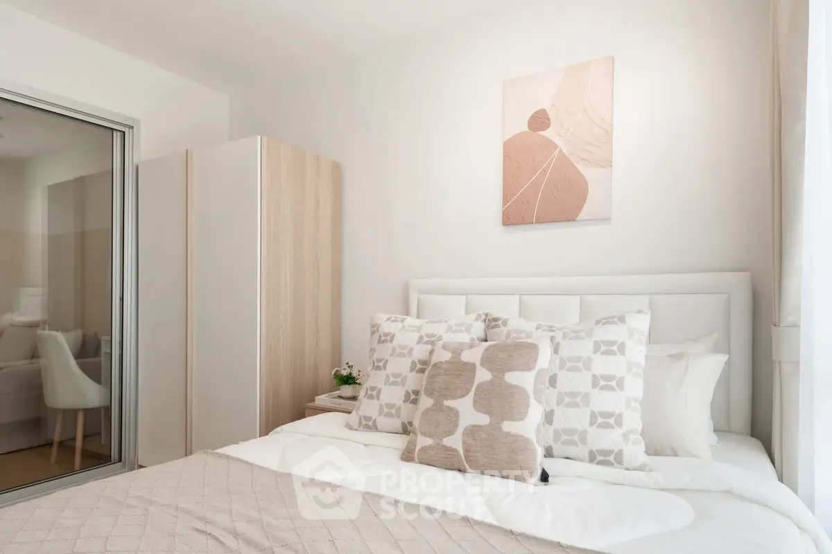 Cozy bedroom with modern decor and ample natural light