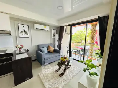 Modern living room with balcony, featuring stylish decor and natural light, perfect for urban living.