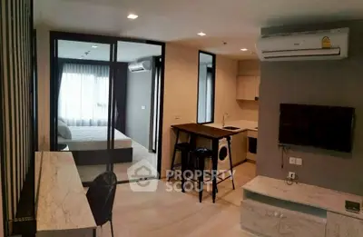 Modern open-plan living room with kitchen and bedroom in stylish apartment