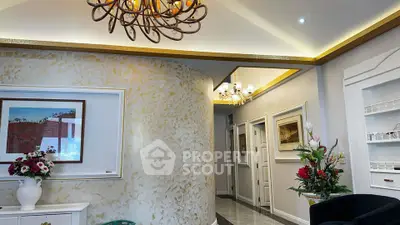 Elegant living room with modern chandelier and tasteful decor