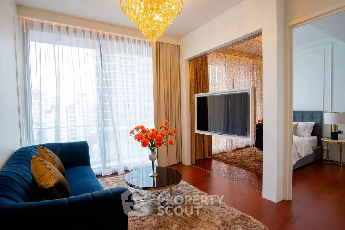 Luxurious living room with elegant decor and city view, featuring plush sofa and modern design elements.