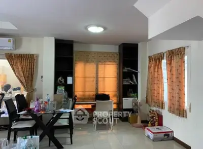 Spacious living room with dining area and ample natural light