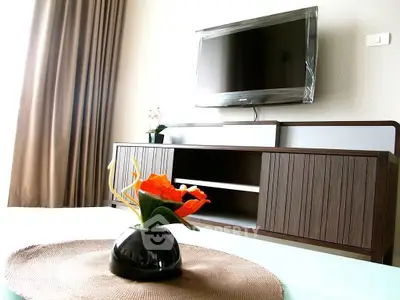 Modern living room with sleek TV setup and elegant decor